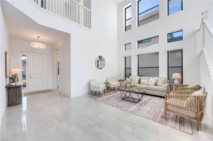 Dramatic wall of windows and soaring ceiling.