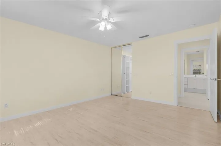 Spare room with ceiling fan and light hardwood / wood-style flooring