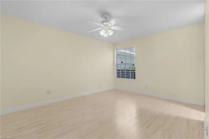 Spare room with ceiling fan and light hardwood / wood-style flooring