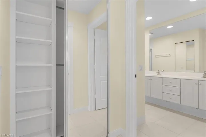 Bathroom with tile patterned floors and vanity