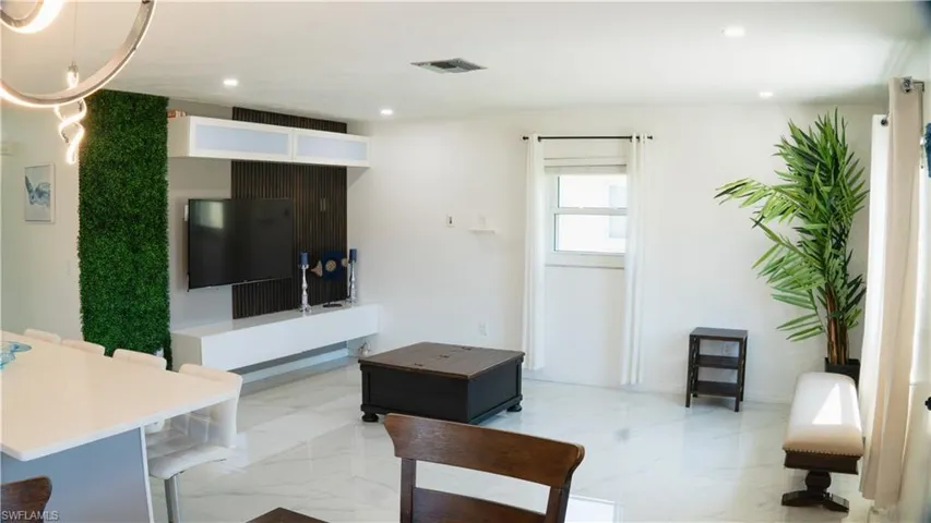 Living area featuring recessed lighting and baseboards