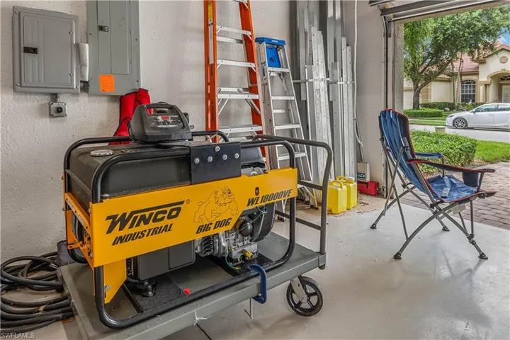 Garage featuring a whole house generator
