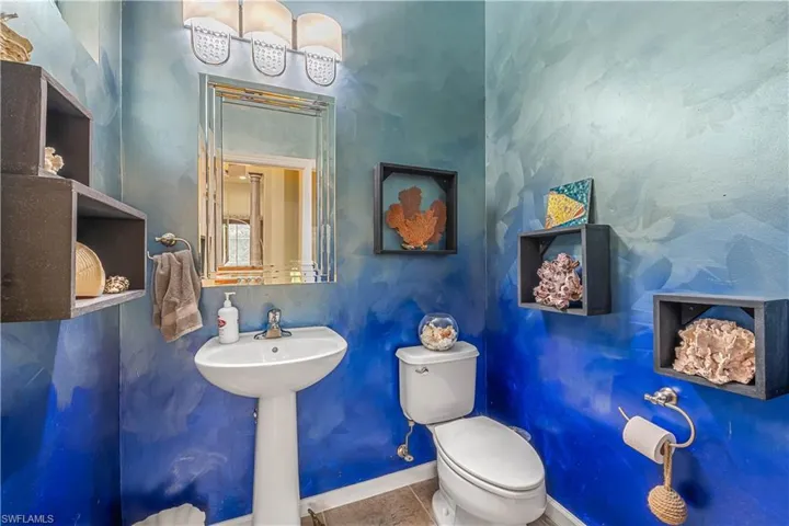 Bathroom with tile patterned floors and toilet