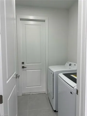 Laundry room featuring washing machine and clothes dryer