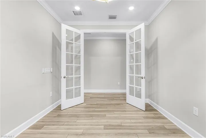 Full bathroom featuring vanity, a shower stall, and light tile patterned flooring