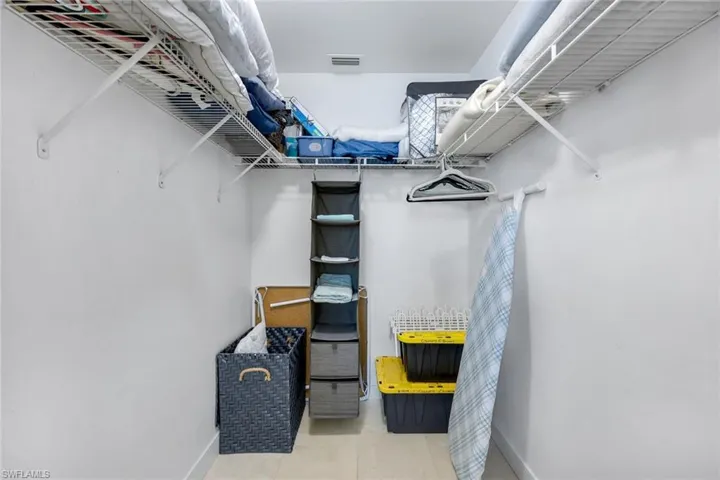 Primary bedroom walk-in closet.