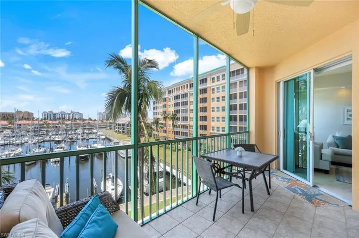 Screened balcony with access to living room and primary bedroom