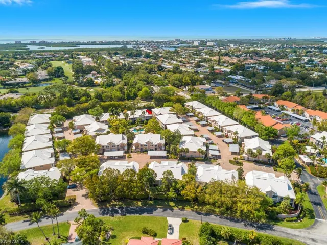 Aerial view of property's location with nearby suburban area