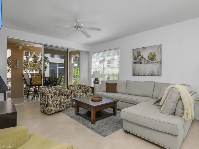 Living area with tile floors and ceiling fan