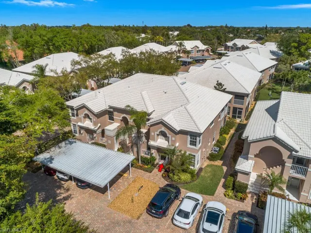 Aerial view of residential area with a tree filled landscape