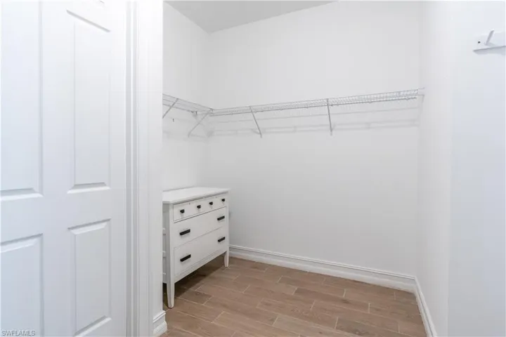 Walk in closet featuring light hardwood / wood-style flooring