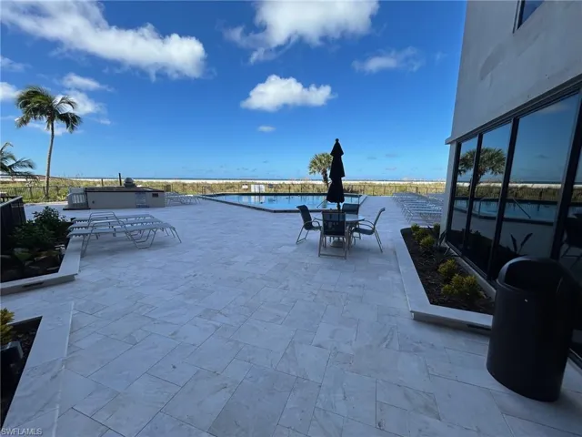 Outdoor pool with outdoor dining area and a patio