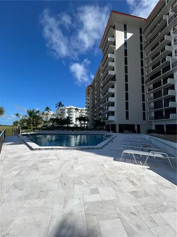 Community pool featuring a patio area