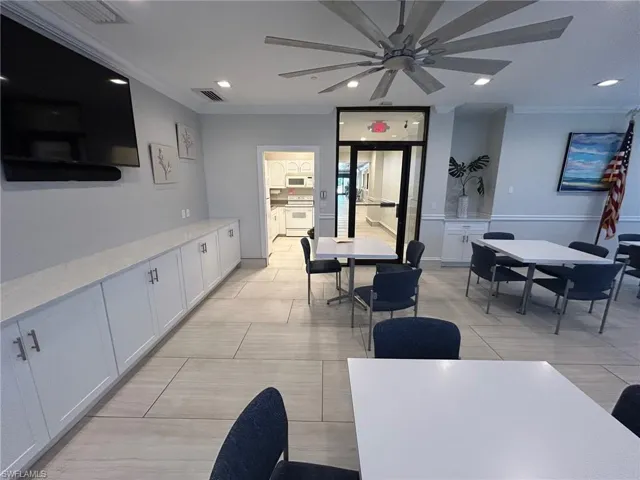 Dining space featuring crown molding, recessed lighting, and ceiling fan