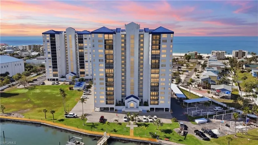 Bird's eye view of a large body of water and apartment complex / building - Virtually Edited Image
