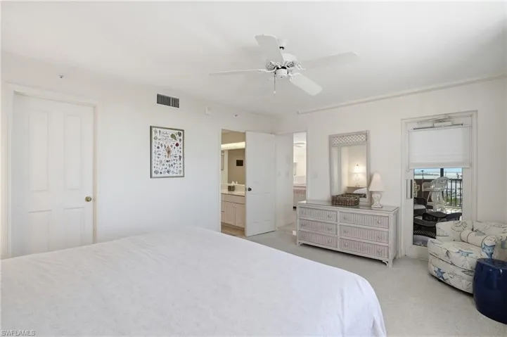 Bedroom with light colored carpet and ceiling fan - Virtually Edited Image