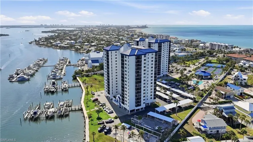 Aerial view of a nearby body of water and apartment complex - Virtually Edited Image