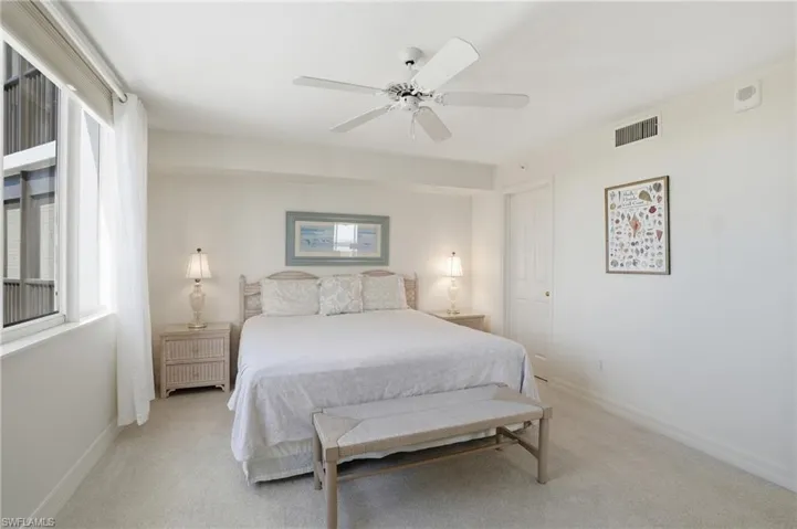 Bedroom featuring ceiling fan and carpet floors - Virtually Edited Image