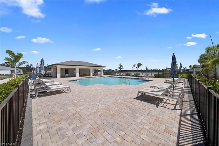 Community pool with a patio area