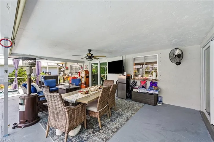 To referigerators, grill, smoker, eating area and sitting area