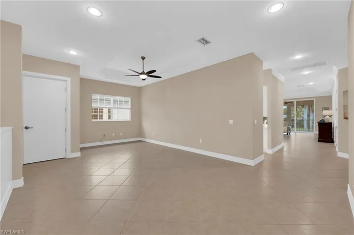 Unfurnished room featuring ceiling fan, recessed lighting, and light tile patterned floors