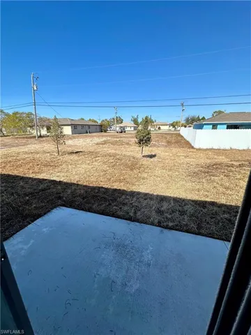 View of yard featuring a residential view and a patio area