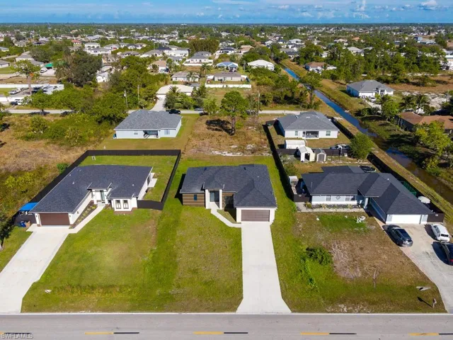 View of property location with nearby suburban area