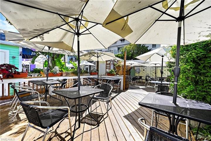 Outdoor seating in The Shoppes of Olde Marco, adjacent to Ville De Marco