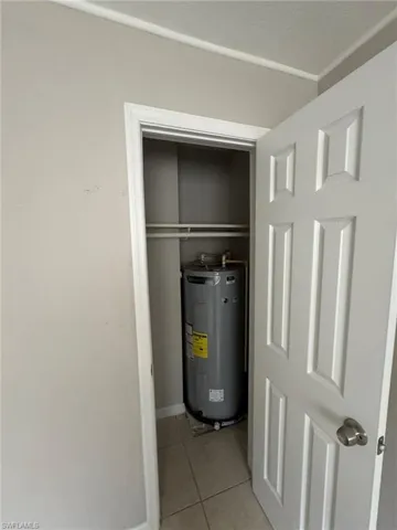 Utility room featuring water heater