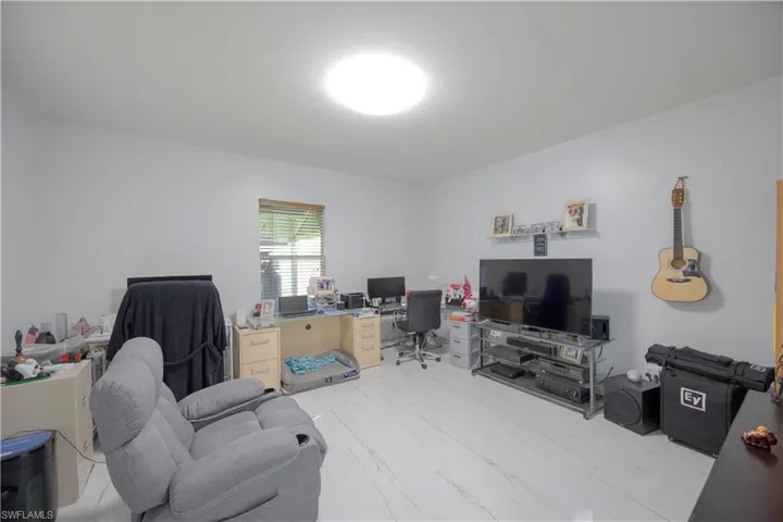Home office with marble finish floor