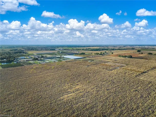 Aerial view of sparsely populated area with extensive farmland