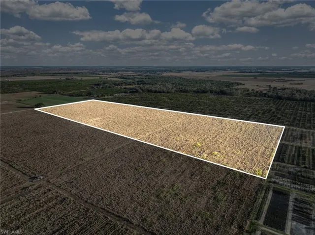 Overview of rural landscape featuring abundant farmland and property parcel outlined