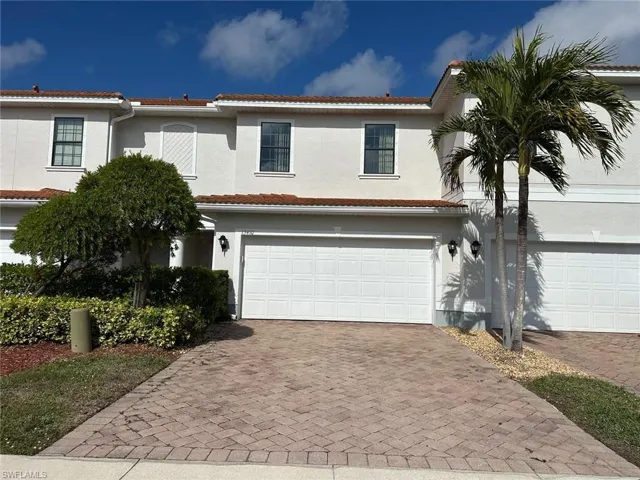 Mediterranean / spanish-style house featuring a garage