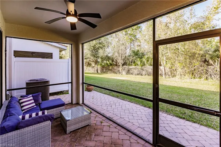 Sunroom featuring ceiling fan
