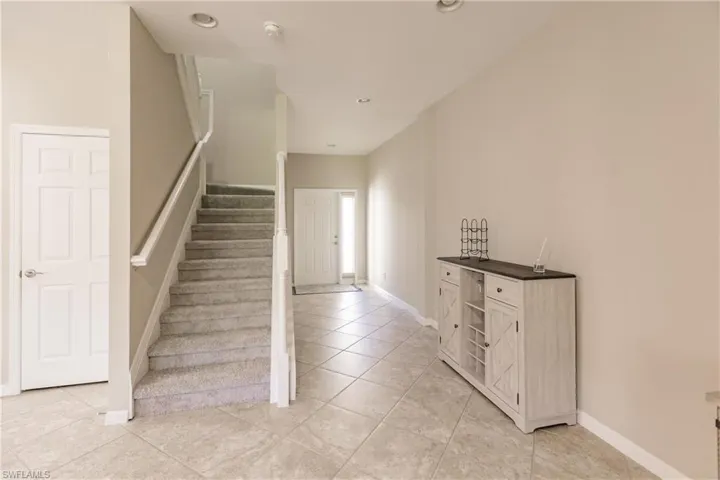 Stairway with tile patterned floors