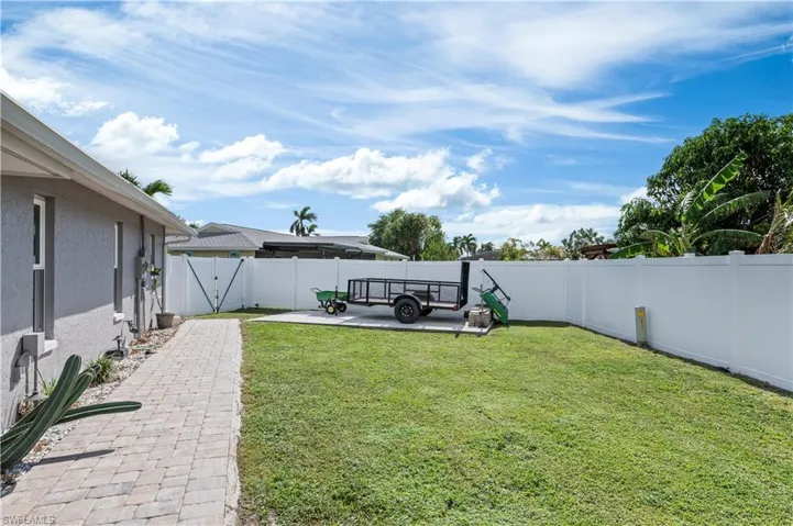 View of side yard with concrete pad