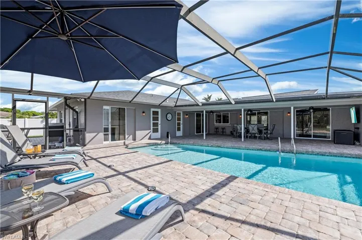 View of swimming pool featuring large patio