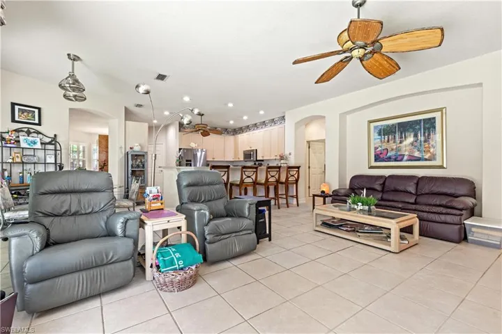 Tiled living room with ceiling fan