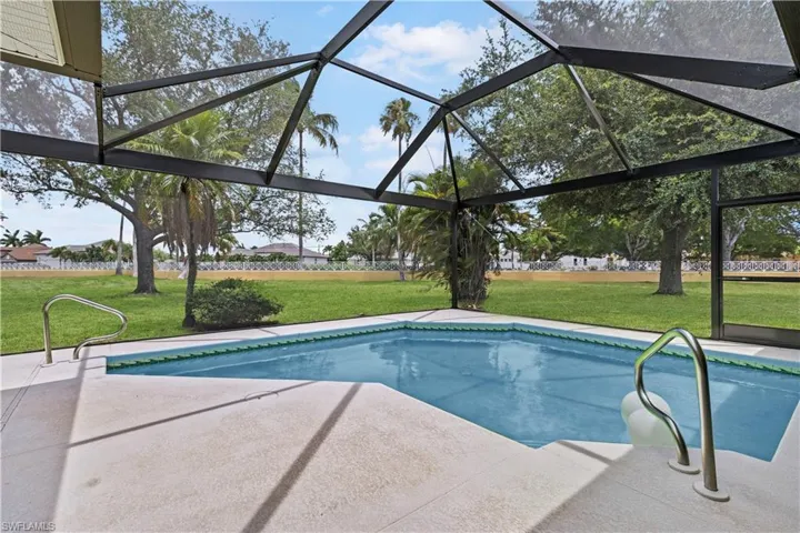 View of swimming pool featuring a yard and a patio area