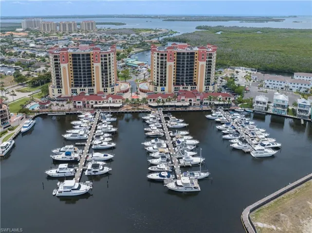 Birds eye view of property with a water view