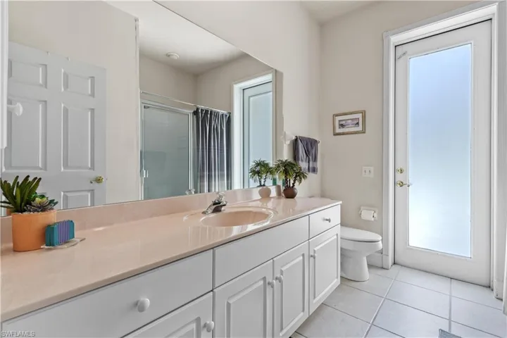 Bathroom with tile floors, toilet, and vanity