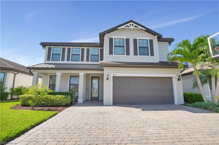View of front facade featuring a garage
