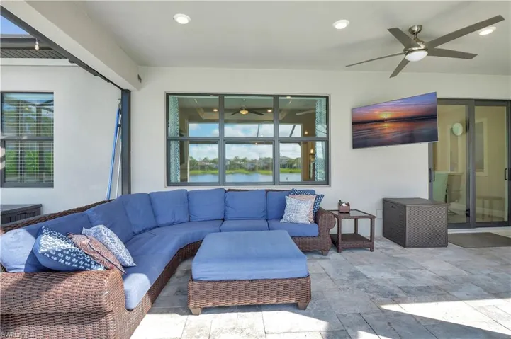 Living room featuring ceiling fan and a healthy amount of sunlight