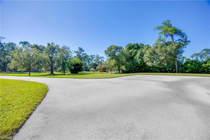 Large parking pad in front of house for visitors and easy turnaround.