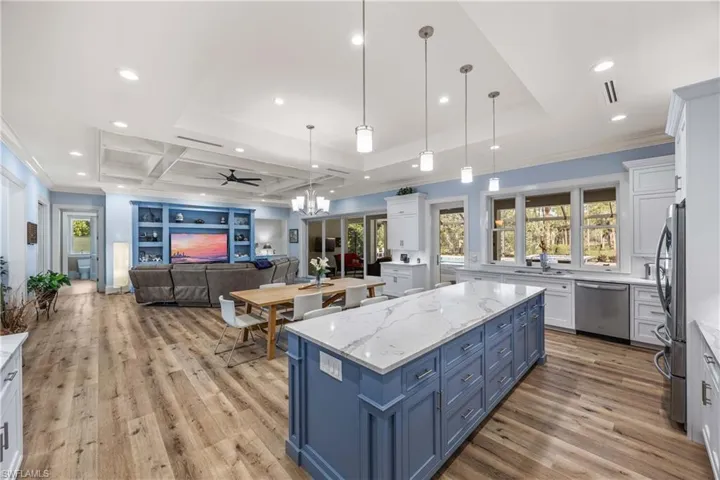 View from kitchen across Great room to formal dining area and family area.