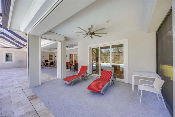 Large under cover lanai space with roll down shutters.