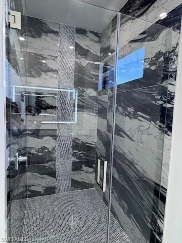 Bathroom featuring walk in shower