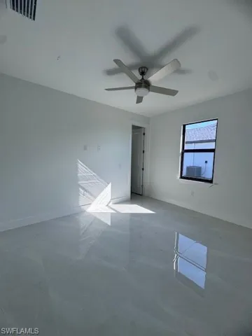 Unfurnished room with ceiling fan