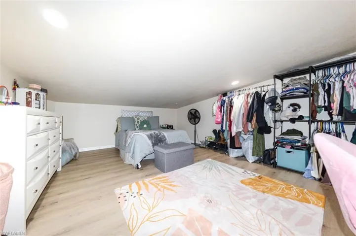 Bedroom featuring light wood-type flooring and recessed lighting