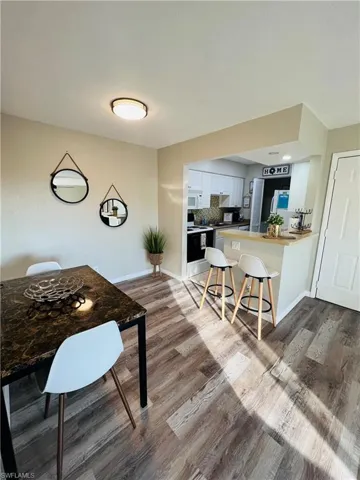 Dining area featuring light wood finished floors and baseboards
